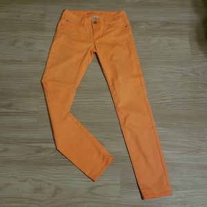 Neon orange skinny jeans